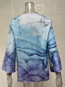 Close-up back view of blue and purple abstract printed long sleeve casual top detail.