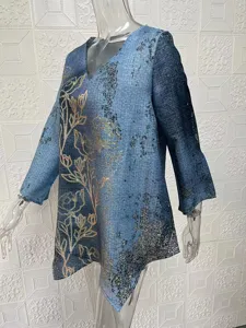 Detailed view of the casual loose asymmetric printed long sleeve V-neck top for women.
