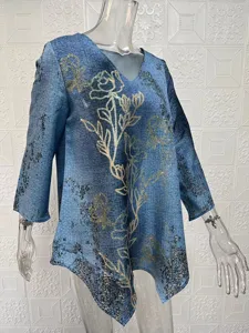 Blue floral print long sleeve V-neck irregular hem blouse top, casual loose summer apparel detail.