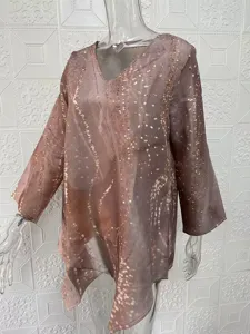 Casual loose V-neck long sleeve top featuring irregular hem and abstract print pattern.