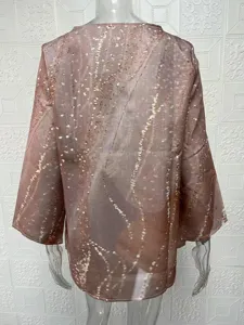 Back detail of women's loose long sleeve blouse featuring unique irregular abstract print.