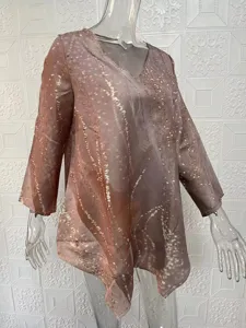 V-neck long sleeve blouse featuring an abstract print, irregular hem and loose fit.