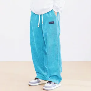 Men's casual corduroy wide leg pants detail view showing the textured blue fabric and drawstring.