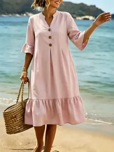 Chic pink v-neck summer midi dress with buttons and ruffle hem for women beach vacation.
