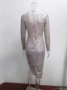 Detailed back view of the metallic sparkly long sleeve party dress showing slim fit design.