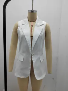 Detailed view of the solid white sleeveless blazer jacket lapel and button detail.