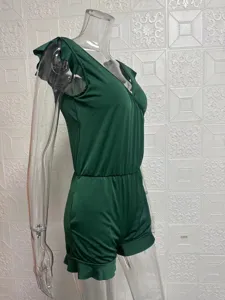 Side view detail of dark green one-piece swimsuit with V-neck and cute ruffle straps.