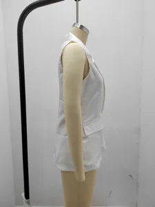 Side detail view of a solid white sleeveless blazer vest, classic lapel, clean minimalist style.