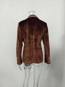Detailed back view of an elegant brown velvet slim-fit blazer featuring gold cuff buttons.