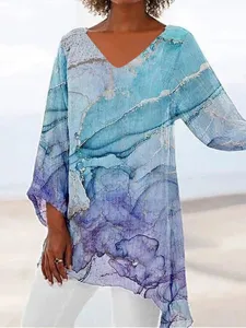Close-up view of the casual long sleeve V-neck top featuring a unique abstract print.