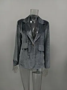 Close-up of grey velvet blazer featuring elegant tailored fit and luxurious soft texture