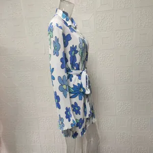 Floral print long sleeve shirt dress with belt, side view of blue floral tunic dress style.