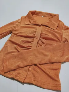 Women's orange textured long sleeve collared button-down slim fit casual cardigan shirt top.