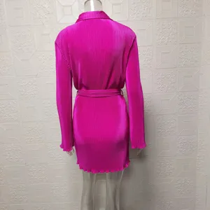 Hot pink pleated long sleeve shirt dress featuring a classic collar and stylish fabric belt.