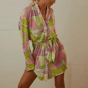 Women's retro abstract print pleated shirt dress with long sleeves and stylish waist belt.
