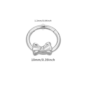 Titanium piercing ring with a cute bow detail, 1.2mm thickness and 10mm diameter size.