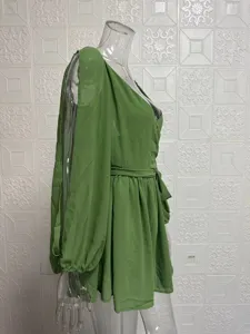 Side view of green mesh long sleeve dress, V-neck backless slim short dress detail.