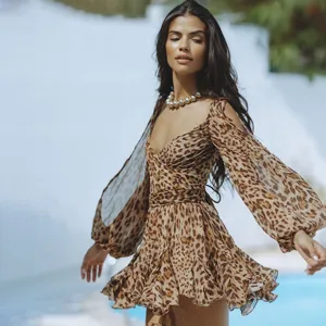Leopard print mesh long sleeve mini dress detail, chic cold shoulder and elegant lace-up back design.