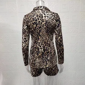 Detailed rear view of a fashionable women's leopard print blazer and shorts two-piece outfit.