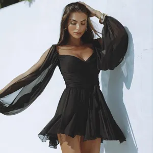 Chic black long sleeve mesh mini dress with wrap V-neck and tie waist for women styling.