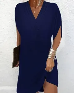 Dark blue V-neck pleated batwing sleeve dress detail showcasing elegant drape and stylish design.