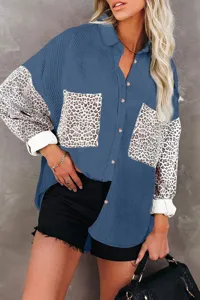 Detailed view of the stylish blue corduroy leopard splice shirt sleeve and pocket design close up.