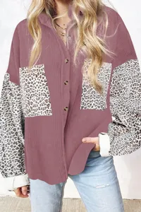 Women's corduroy button down shirt with leopard print patchwork long sleeves and chest pockets.