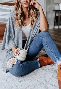 Casual waffle knit cardigan featuring loose fit and stylish three-quarter sleeves for autumn.