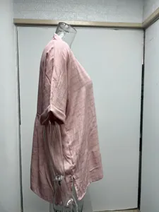 Pink short sleeve V-neck blouse, loose fit thin summer shirt, side view apparel detail.