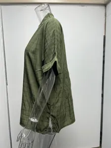 Details of the olive green short sleeve plaid V-neck loose shirt fabric and side hem view.