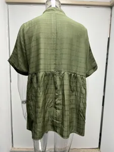 Back detail of green short sleeve loose blouse, lightweight grid fabric with gathered pleats.