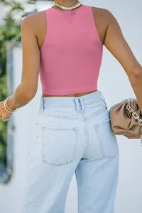 Women solid pink sleeveless racerback tank top back view detail showing slim fit design.