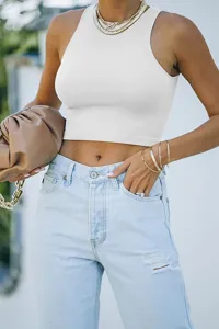 Detail view of a solid white sleeveless racerback crop top, stylish summer fashion basic wear.