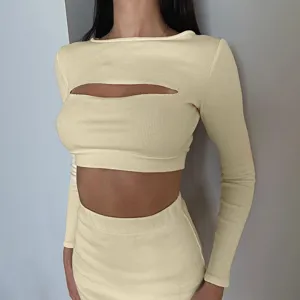Chic yellow ribbed long-sleeve cutout crop top and matching skirt set detail view.