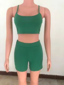 Solid color crop top camisole and biker shorts two-piece activewear set for women.