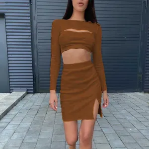 Detailed view of the brown women two-piece set, featuring a cutout long-sleeve top and split skirt.