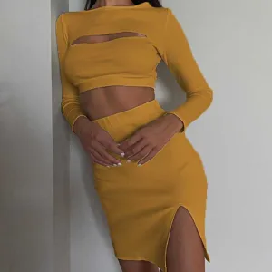 Yellow ribbed two-piece outfit, long sleeve cutout crop top and high slit skirt detail.