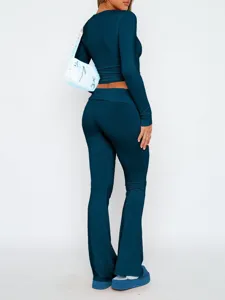 Dames lange mouw crop top en lage taille uitlopende broek casual outfit set.