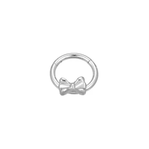 Close up view of titanium bow clicker ring detail, showing smooth hinge and charm.
