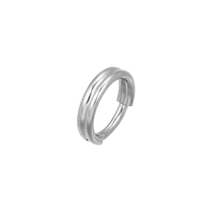 Close-up detail of titanium steel multi-layer seamless piercing ring ear jewelry.