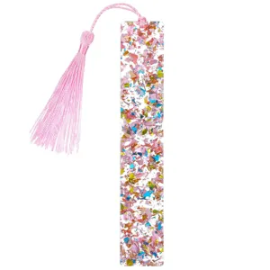 Transparenter Acryl-Glitzer-Lesezeichen mit süßer rosa Quaste, ideal für Leseliebhaber.