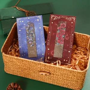 Metal hollow bookmark set with exquisite floral and rose designs on display cards inside basket