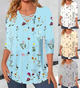 Detailed view of the floral print long sleeve T-shirt featuring a chic crisscross V-neck.