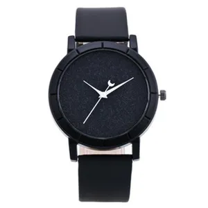 Black minimalist quartz watch detail view showcasing textured starry dial and band.