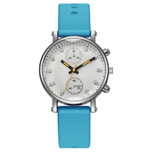 Reloj de cuarzo para mujer con correa de silicona azul, esfera blanca grande y brillantes de estrás.