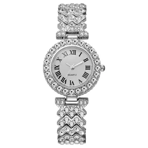 Close-up of a silver rhinestone women quartz watch with crystal bezel and Roman dial.