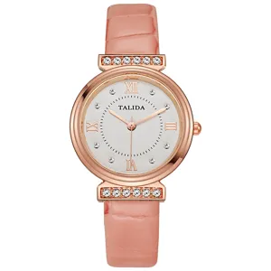 Women quartz watch detail featuring pink leather strap, rose gold case and sparkling rhinestones.