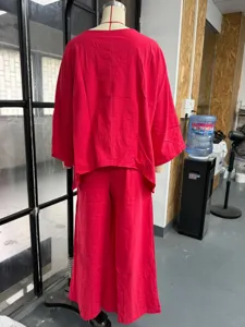 Detail view of the red cotton linen batwing top and wide leg pants set, casual loose fit.