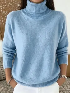 Detailed view of the light blue knit turtleneck sweater texture and cozy collar design.