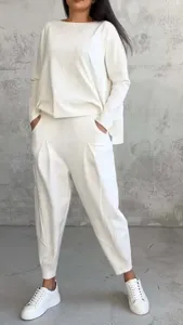 Casual solid white long sleeve sweatshirt and stylish harem pants two piece set for women.